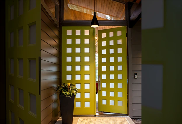 Double door painted yellow with 27 lites
