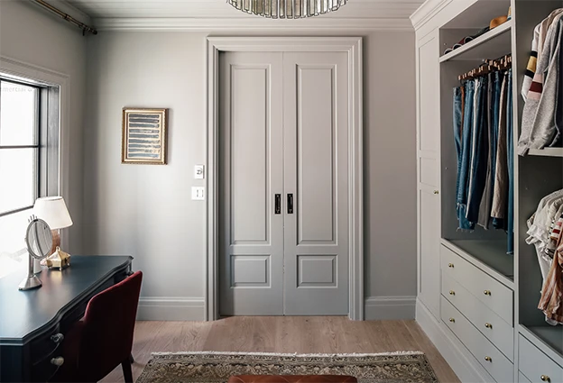 Gray double pocket door installed in the closet of master bedroom