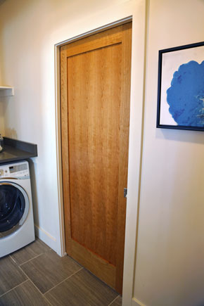 Laundry with interior wood door