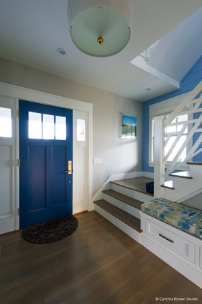 Entryway with wood front door and sidelights