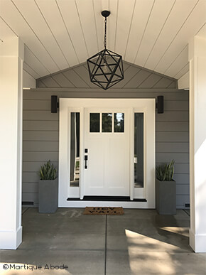 Entryway with front door and sidelights