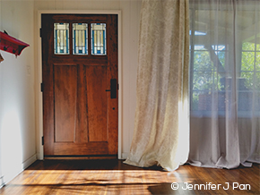 Entryway with wood front door