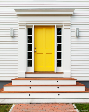 Entrance with exterior wood door