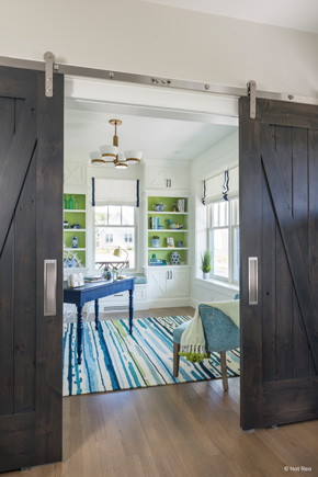 Den with interior barn doors