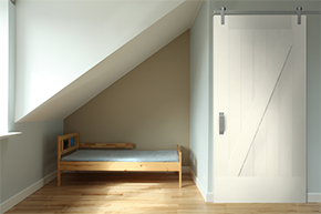 Bedroom with interior barn door