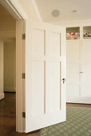 Bedroom with interior wood panel door