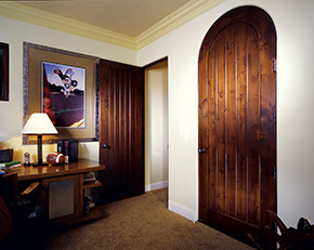 Custom arch interior knotty alder doors