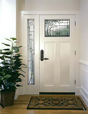 Entryway with wood front door and sidelight