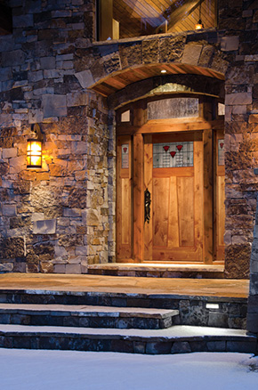 entryway with knotty alder front door and sidelights