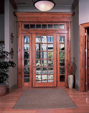 Entryway with knotty pine exterior door and sidelights