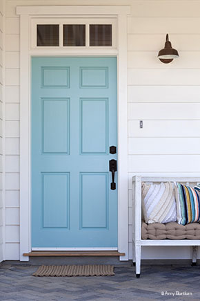Front porch with wood front door and transom