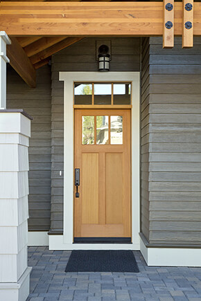 Entryway with wood front door