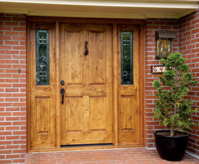 Porch with knotty alder front door and sidelights