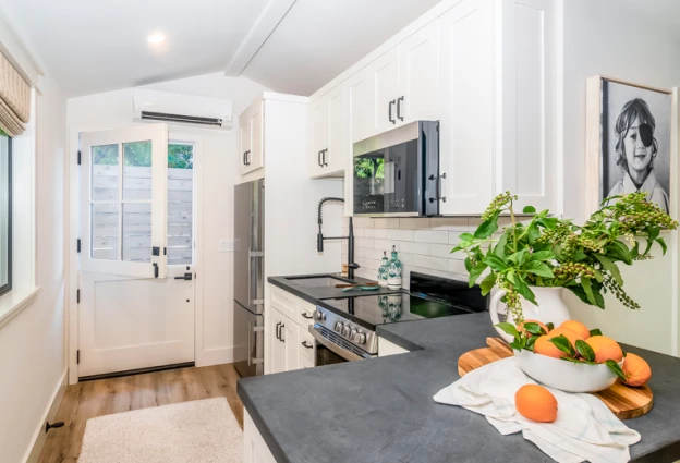 White modern Dutch door in a kitchen entry.